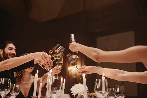 Friends celebrating new years with champagne