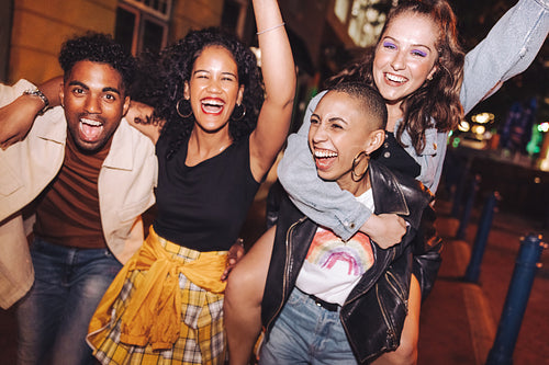 Group of friends laughing and living their best lives in the cit