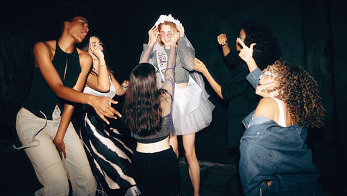 Group of women celebrating a party with cheerful and spirited expressions
