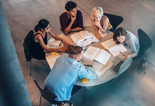 Studying group of students at the table