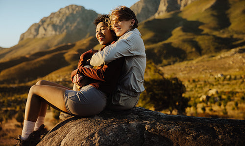 Couple embracing on mountain landscape
