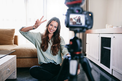 Young woman recording content for her blog.