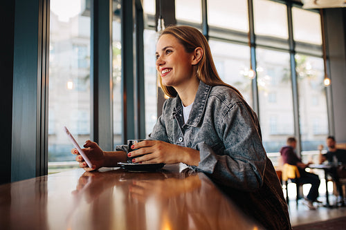 Woman relaxing at a coffee shop