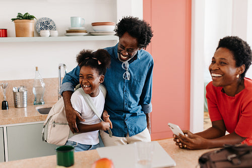 Fun morning routine: Family getting ready for their day with laughter