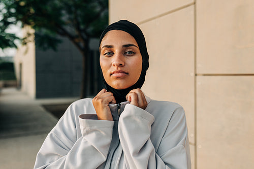 Portrait of a sporty Muslim woman looking at the camera outdoors