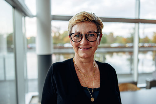 Senior business woman standing in office