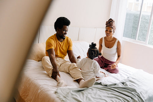 Family bonding on a cozy bed
