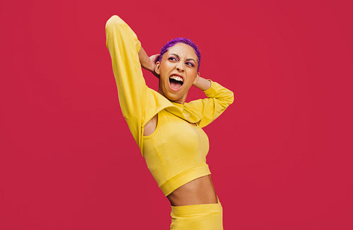 Stylish young woman standing in a studio