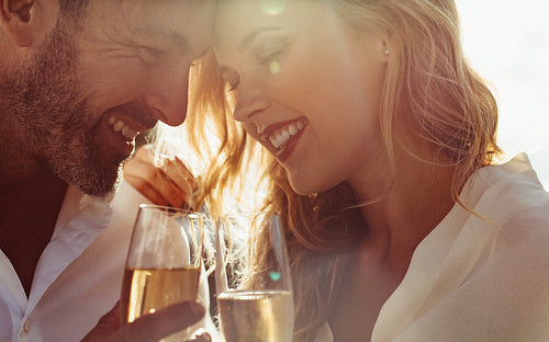 Romantic couple with wine outdoors