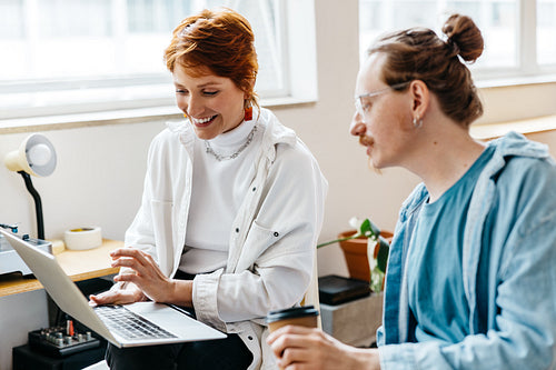 Colleagues collaborating happily in a modern co-working space