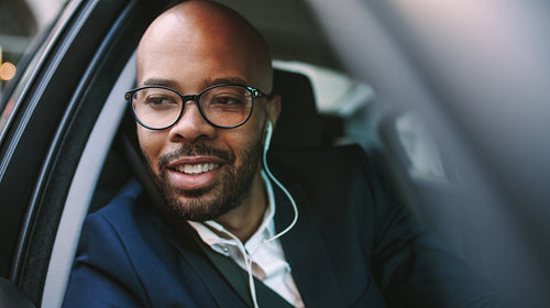 African business man driving car to office