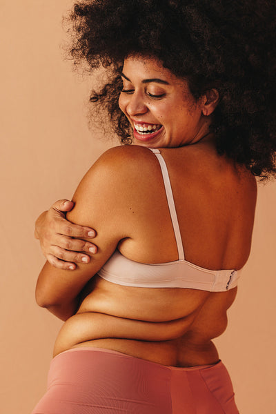Curvy young woman embracing her natural body