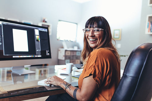 Illustrator working on computer in office