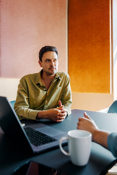 Young professionals engaging in a discussion in a modern office setting