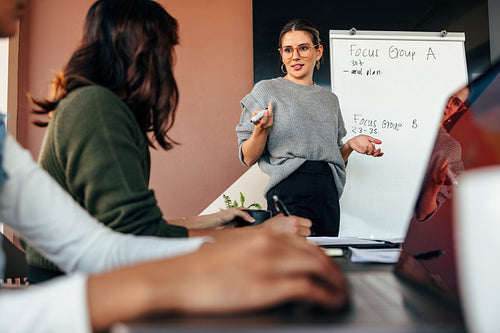Businesswoman giving a presentation in a modern office