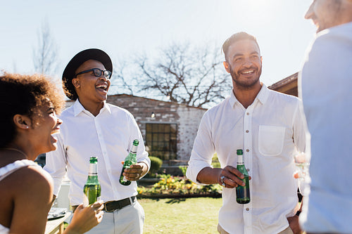 Group of young friends enjoying at party outdoors