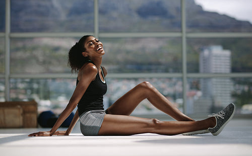 Smiling female resting after exercising