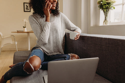Businesswoman working from home on laptop