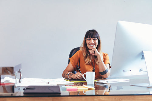 Illustrator working on her drawings at office
