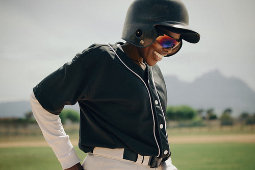 Professional baseball player wearing a uniform and helmet with sunglas Jacob Lund Photography Store premium stock photo