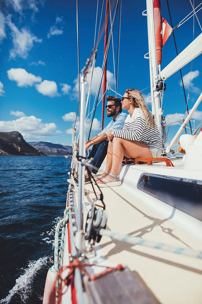 Couple sitting together on the deck of a yacht