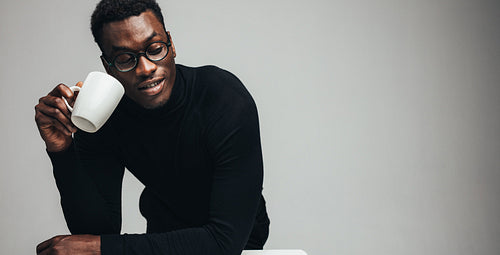 African man having coffee