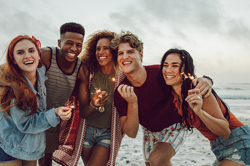 Friends celebrating new year's day at the beach