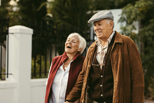 Senior couple walking outdoors on a winter day