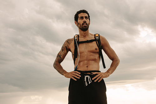 Fit man taking rest after outdoor workout