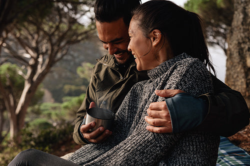 Young couple camping in countryside