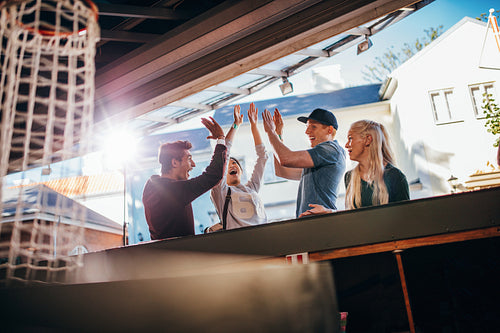 Excited young friends at amusement park