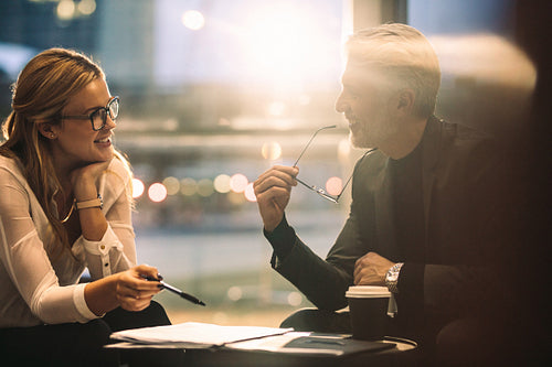 Businesswoman discussing work in colleague