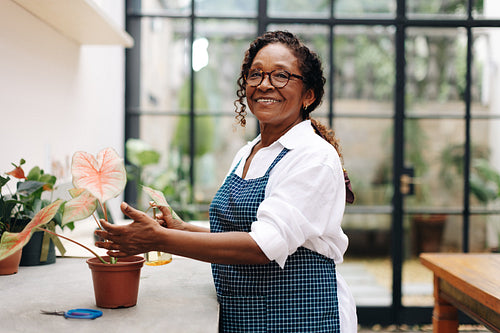 Black business woman growing flowers for her floral startup