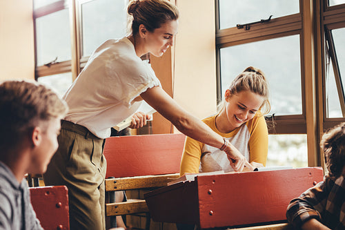 Teacher assisting a student in the classroom