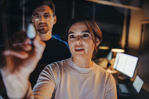 Team collaboration at night: Colleagues having a business strategy meeting with creative ideas