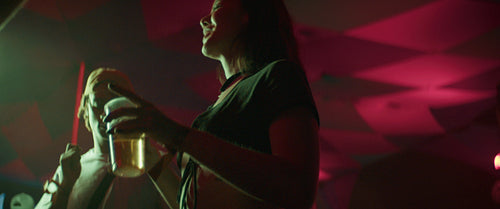 Group of friends dancing and enjoying live music at festival concert