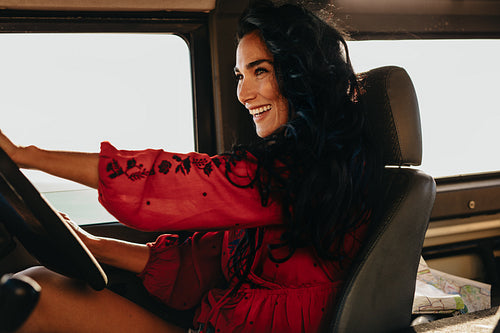 Smiling woman driving a car