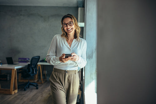 Cheerful businesswoman in office