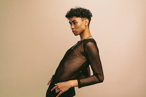 Gay man in black mesh t-shirt