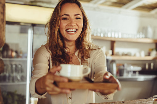 Waitress serving a coffee