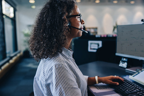 Female professional with headset at work