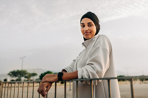 Athletic Muslim woman looking at the camera outdoors