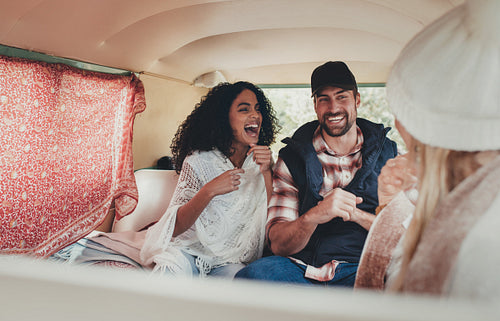 Friends in van enjoying road trip