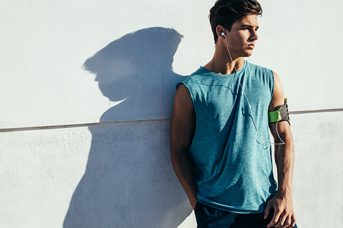 Handsome young man relaxing after a run