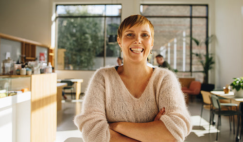 Confident female executive standing in office