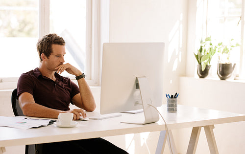 Entrepreneur working on computer at home