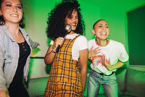 Girls singing together on karaoke night