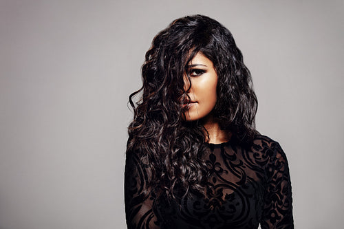 Attractive brunette with shiny curly hair