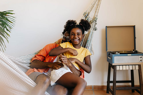 Father-daughter relaxation: Fun and quality time in a hammock