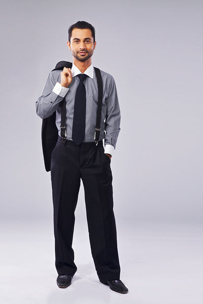 Young Manager Holding A Coat Over His Shoulder